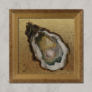 May include: Square framed painting of an oyster shell with a pearl. The artwork features a gold background and a brown, white, and green oyster shell. The frame is a light brown color. The painting is signed in the lower left corner.