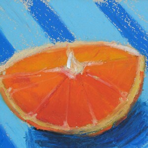 May include: A close-up of a bright orange orange slice on a blue and white striped background. The orange slice is cut in half and shows the segments of the fruit.