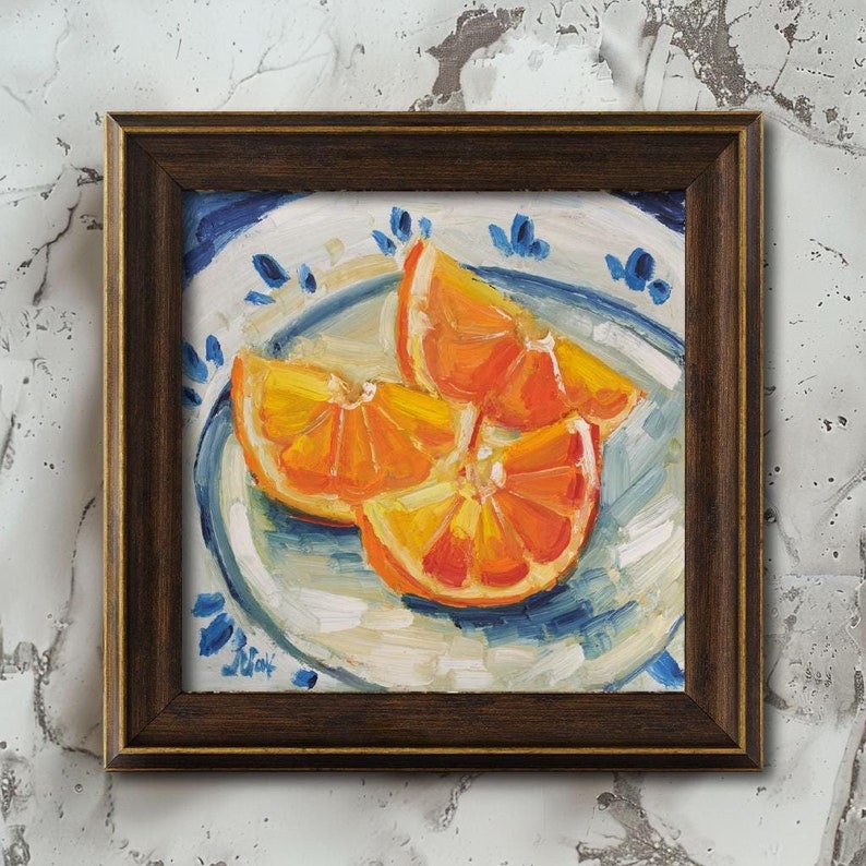 Original oil painting of juicy orange slices, elegantly presented in a frame. The artwork is captured in a vibrant impressionist style with bold, thick brushstrokes that highlight the glistening texture of the fruit. Featuring a bright citrus palette and a beautiful play of light, this small fruit still life is a perfect pop of color for a modern kitchen or a sunny dining room wall.