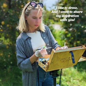 May include: A person wearing a dark patterned button-down shirt, a light-colored top, and blue jeans, holding a paintbrush over a wooden easel box. The text "I like to draw. And I want to share my inspiration with you!" is visible in the upper right corner.
