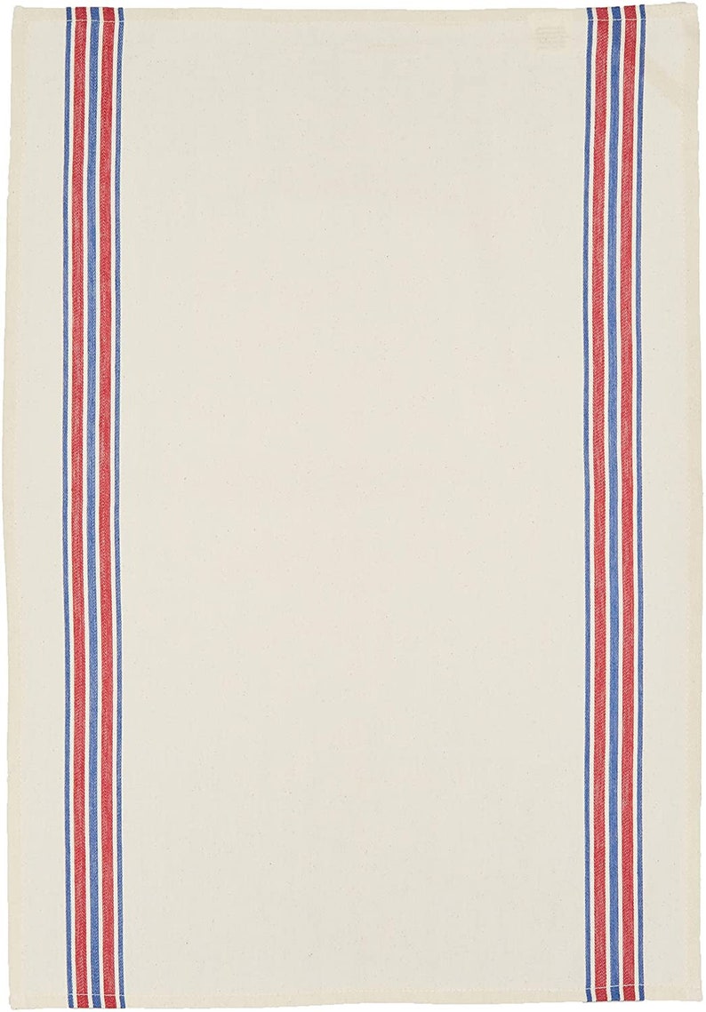 May include: A white kitchen towel with red and blue stripes along the sides.