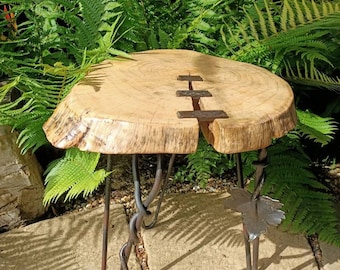 Hand forged decorative metal and wood table.