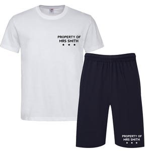 May include: White t-shirt and navy blue shorts with the text "PROPERTY OF MRS SMITH" and three stars on each piece of clothing.