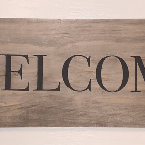 Rustic Farmhouse Signs says &quot;Welcome.&quot;
