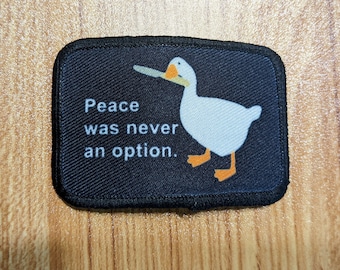 Peace was Never an Option goose meme 2"x3" removable morale patch with hook and loop backing