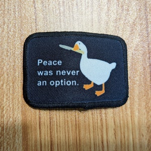 Peace was Never an Option goose meme 2"x3" removable morale patch with hook and loop backing