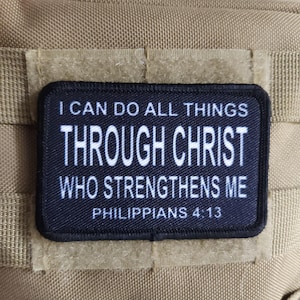 May include: Black and white patch with the text "I can do all things through Christ who strengthens me Philippians 4:13".