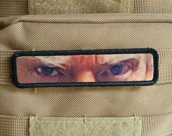 mug shot eyes watching you 1"x4" removable morale patch with hook and loop backing good for back of operator hats