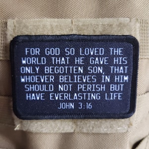 May include: Black and white patch with the text "FOR GOD SO LOVED THE WORLD THAT HE GAVE HIS ONLY BEGOTTEN SON, THAT WHOEVER BELIEVES IN HIM SHOULD NOT PERISH BUT HAVE EVERLASTING LIFE JOHN 3:16"