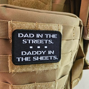 May include: Black patch with white text that reads "Dad in the streets. Daddy in the sheets."