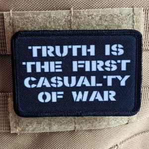 Truth is the first casualty of war 2&quot;x3&quot; morale patch with hook and loop backing