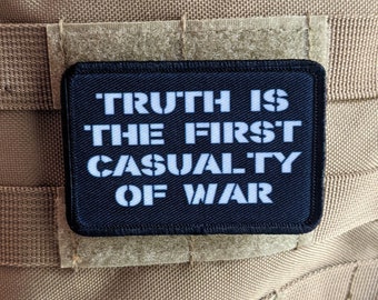 Truth is the first casualty of war 2"x3" morale patch with hook and loop backing