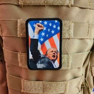 Flag background donald fist in the air  2&quot;x3&quot; morale patch with hook and loop backing military joke meme