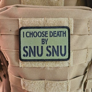 May include: A green patch with black text that reads "I CHOOSE DEATH BY SNU SNU" on a tan background.