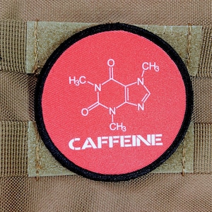May include: A red and black round patch with a white chemical structure of caffeine and the word "CAFFEINE" in white letters.