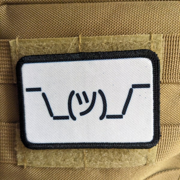 Text idk guy shrugging shoulders white background meme 2"x3" morale patch with hook and loop backing