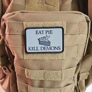 Eat pie kill demons funny meme  2"x3" removable morale patch with hook and loop backing