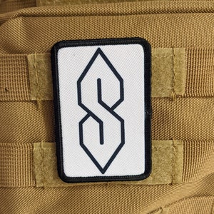 90 年代の「S」字型の描画、古代のミームの知識、白い 2 インチ x 3 インチの士気パッチ、フックとループの裏地付き