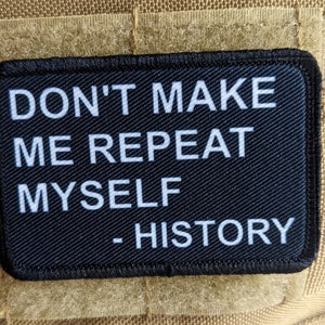 May include: Black patch with white text that reads "Don't make me repeat myself - History".