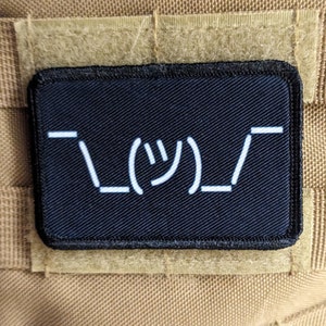 Text idk guy shrugging shoulders black background meme 2"x3" morale patch with hook and loop backing