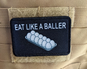 Eat like a baller egg shortage inflation meme  2"x3" removable morale patch with hook and loop backing