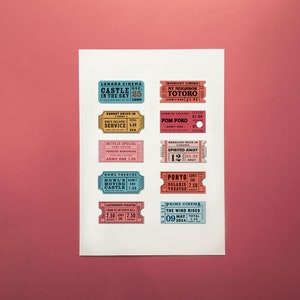 May include: A collection of vintage-style cinema ticket stubs featuring titles such as "Castle in the Sky", "My Neighbor Totoro", "Pom Poko", "Spirited Away", "Howl's Moving Castle", "Ponyo", and "The Wind Rises". The tickets are printed on colourful paper with black text and are arranged in a grid pattern on a white background.