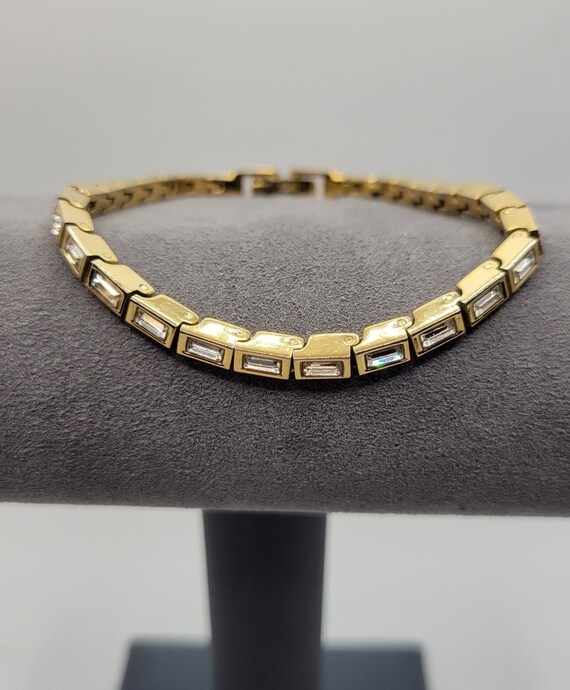 Anne Klein Women`s AK/1418RGTP Swarovski Crystal Accented Rose Gold-Tone  and Taupe Ceramic Bracelet Watch