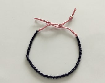 Petite stretchy friendship bracelet in dark blue