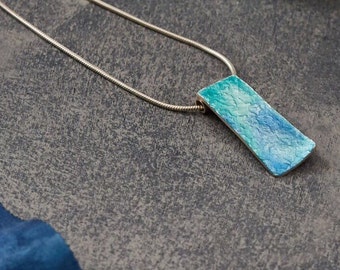 Aqua wave enamel on silver pendant with chain