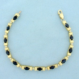 Sapphire and Diamond Line Tennis Bracelet in 14K Yellow Gold