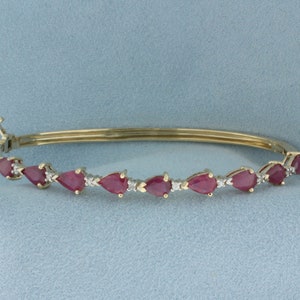 Ruby and Diamond Hinged Bangle Bracelet in 14k Yellow Gold