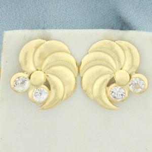 Pinwheel Design CZ oorbellen in 18k geel goud