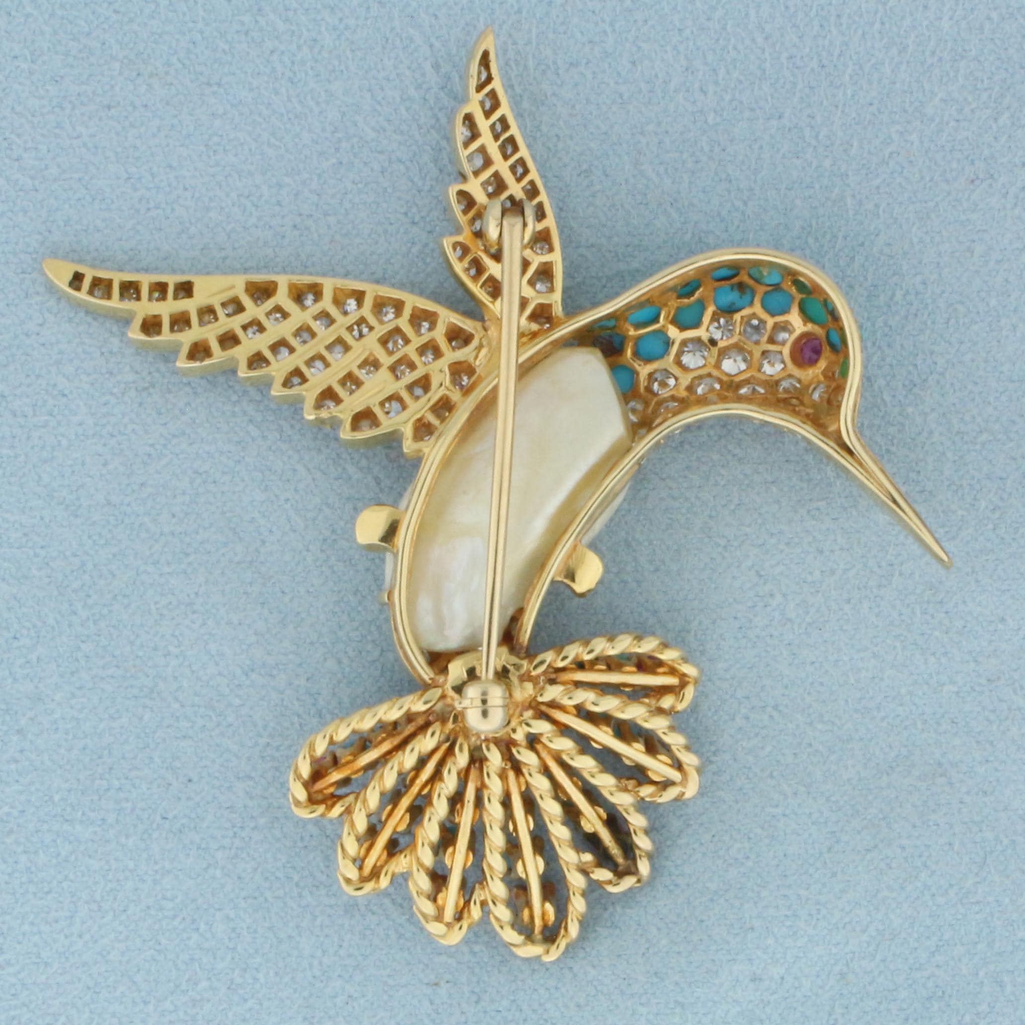 ダイヤモンド、ルビー、ターコイズ、パールをあしらった18Kイエロー