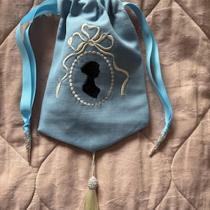 Blue linen embroidered Regency style reticule with Jane Austen silhouette and tassel