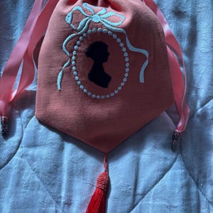 Orange linen embroidered Regency style reticule with Jane Austen silhouette and tassel
