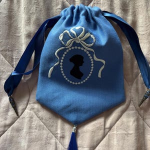 Blue linen embroidered Regency style reticule with Jane Austen silhouette and tassel