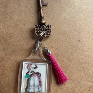 Georgian fashion plate gift key chain.   key pendant.  Bottle opener key pendant.  antique look key with tassel.