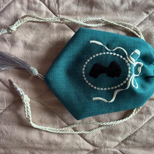 Teal linen embroidered Regency style reticule with Jane Austen silhouette and tassel