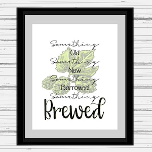 May include: A framed print with a green and white illustration of hops and the text "Something Old, Something New, Something Borrowed, Something Brewed".