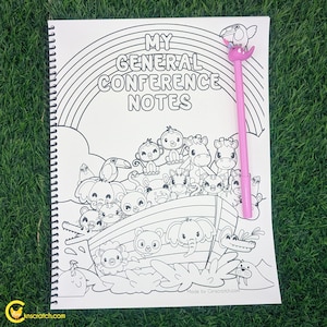 May include: A spiral-bound coloring book with the text "MY GENERAL CONFERENCE NOTES" and a rainbow design. The book features an illustration of animals on an ark. A pink pen with a bird-shaped top rests on the book.