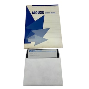 May include: A vintage computer mouse user's guide and setup disk. The user's guide has a blue and white geometric design with the word "MOUSE" prominently displayed. The setup disk is in a white envelope.