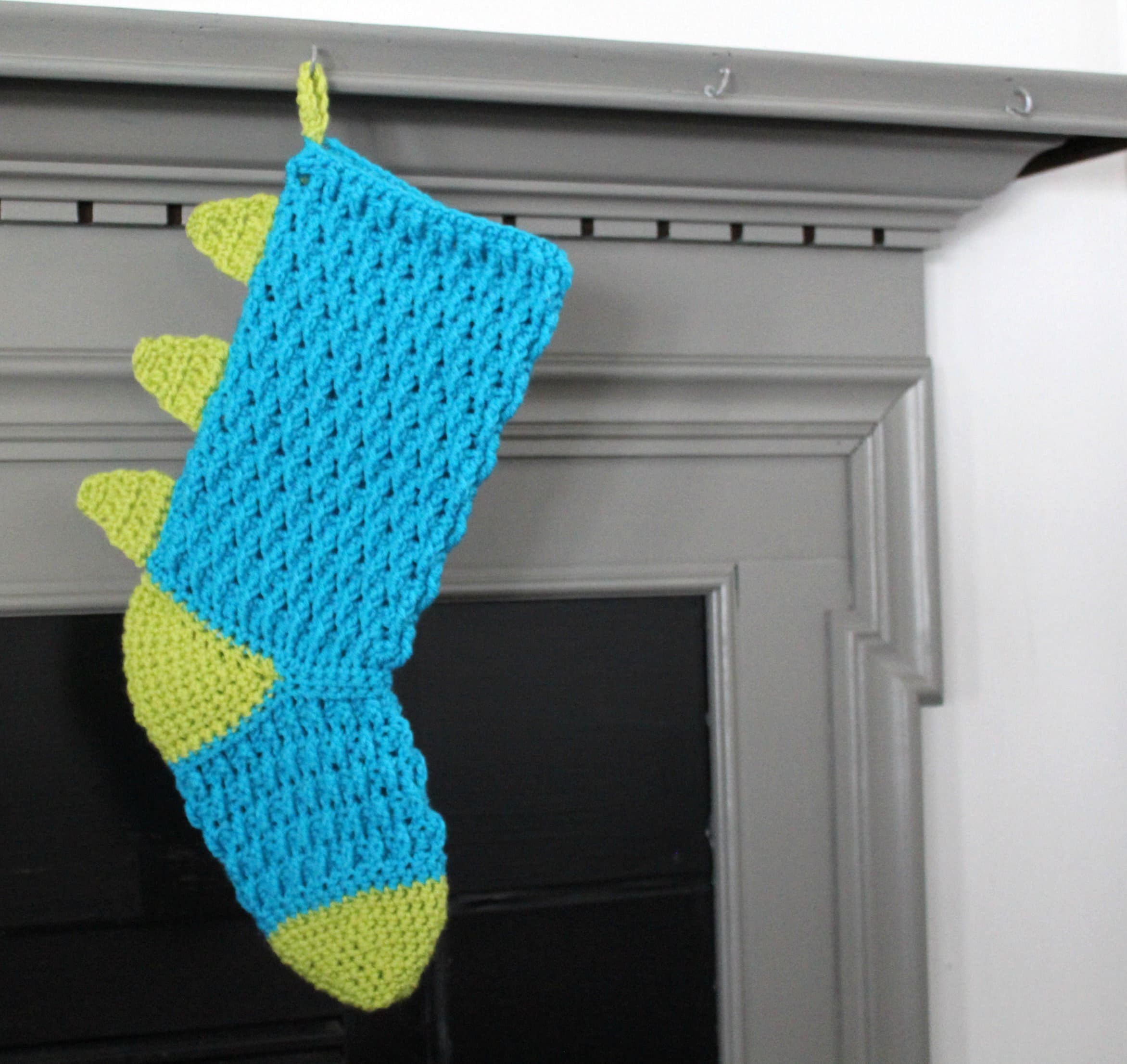 39 Christmas Stocking Crochet Patterns for Handmade Holiday Keepsakes 31 Pattern for the Dinosaur Christmas Stocking Christmas