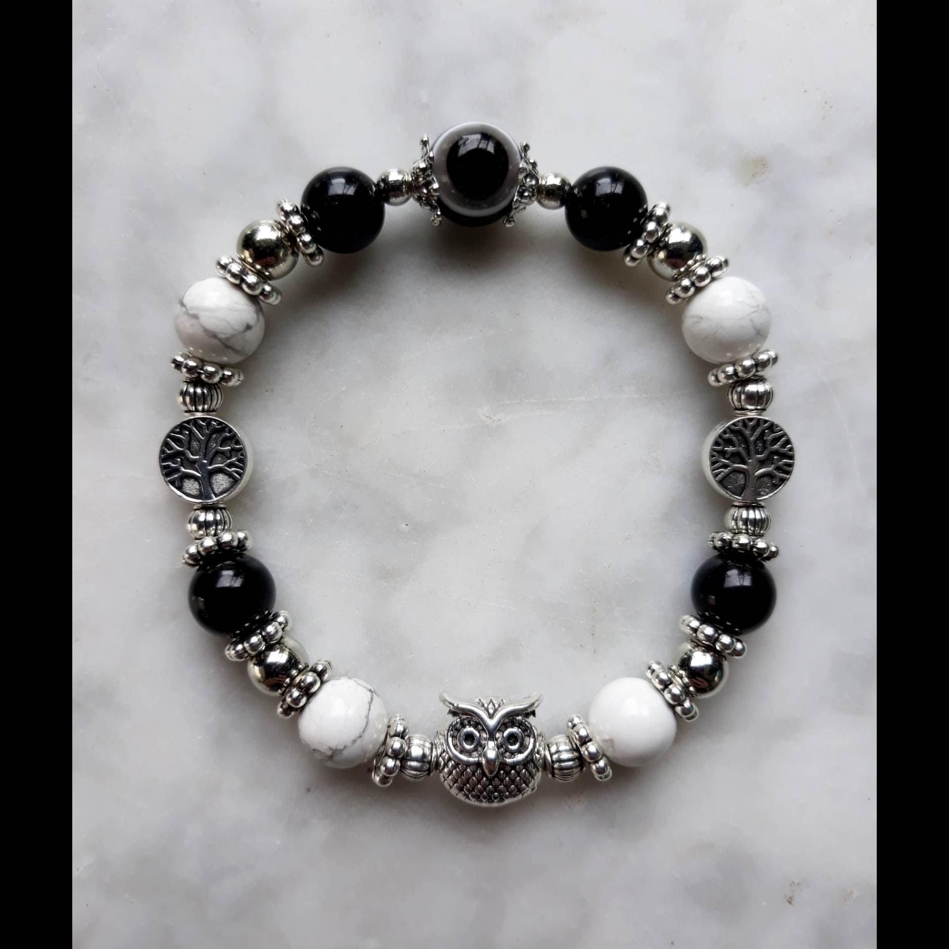 The Owl Spirit Animal Protection Stretchable Bracelet with Tree Charms, Onyx, Howlite, and Black Evi
