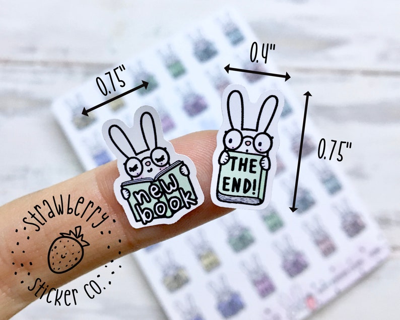 May include: Two bunny stickers, each 0.75 inches wide and 0.4 inches tall. One bunny is reading a book that says "new book" and the other bunny is reading a book that says "the end!"
