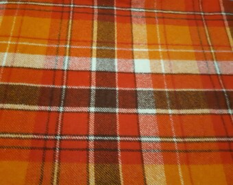Woolen blanket.  Australia made. Shades of red,orange, brown and white.