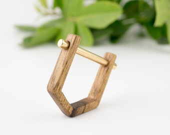 Geometrical fashion statement ring, wooden band and gold top, can be a lovey gift for a loved one.