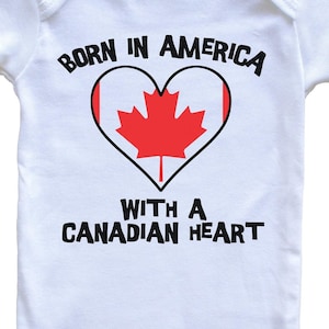 Born In America With A Canadian Heart   Baby Bodysuit Canada Flag Baby Bodysuit