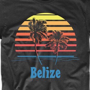 May include: Black t-shirt with a retro sunset graphic featuring two palm trees and the word "Belize" in blue.