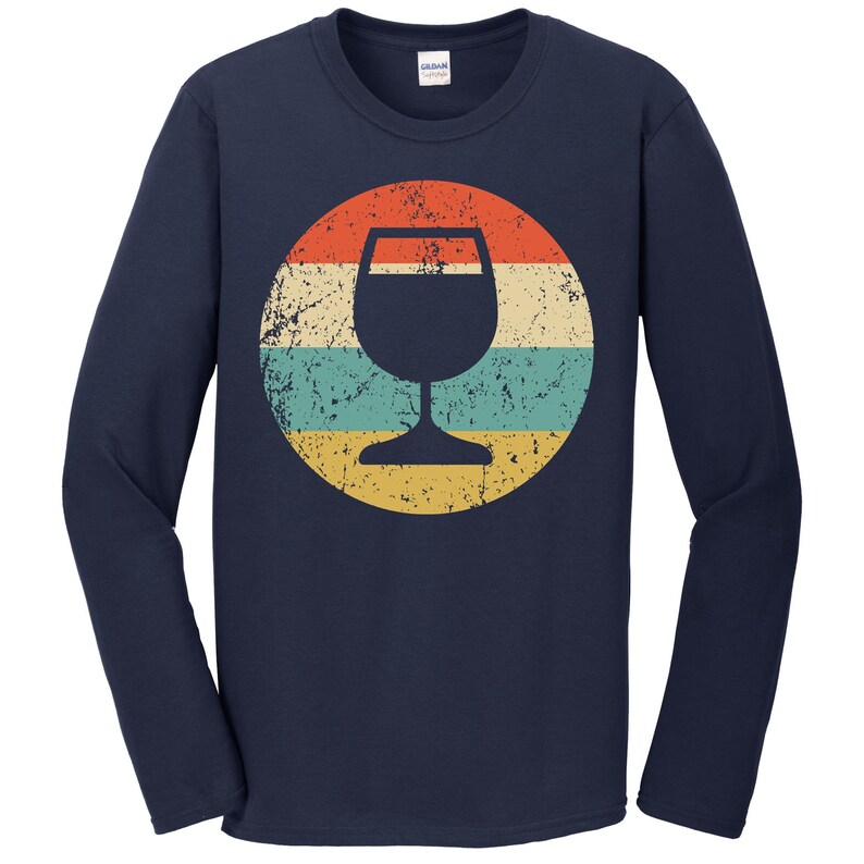 May include: Navy blue long-sleeve t-shirt with a vintage-style graphic of a wine glass in a circle with red, yellow, and blue stripes.