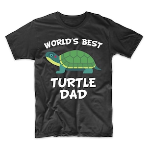 May include: Black t-shirt with white text that reads "World's Best Turtle Dad" and a cartoon image of a green turtle.